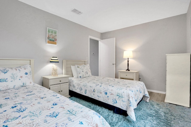 bedroom featuring dark wood-type flooring