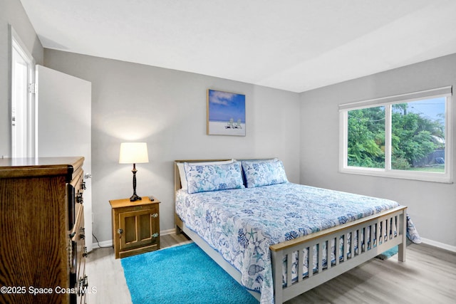 bedroom with light wood-type flooring