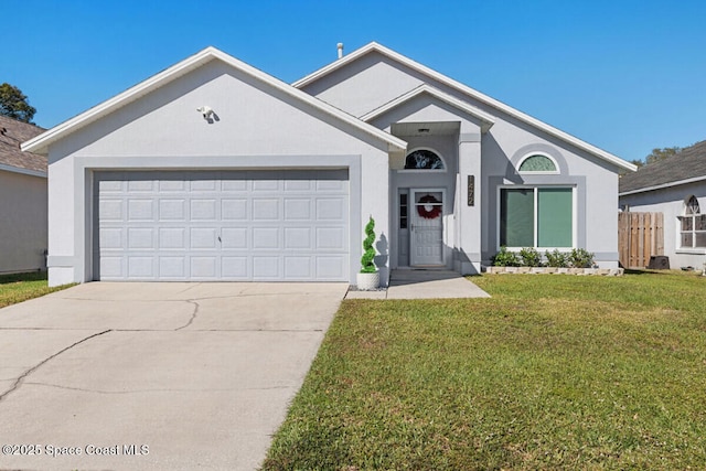 single story home featuring a front yard and a garage