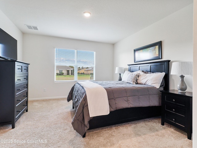 bedroom with light carpet