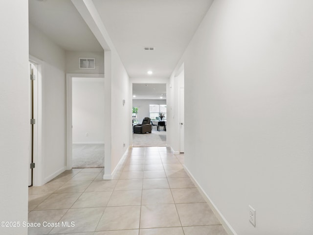 hall with light tile patterned flooring