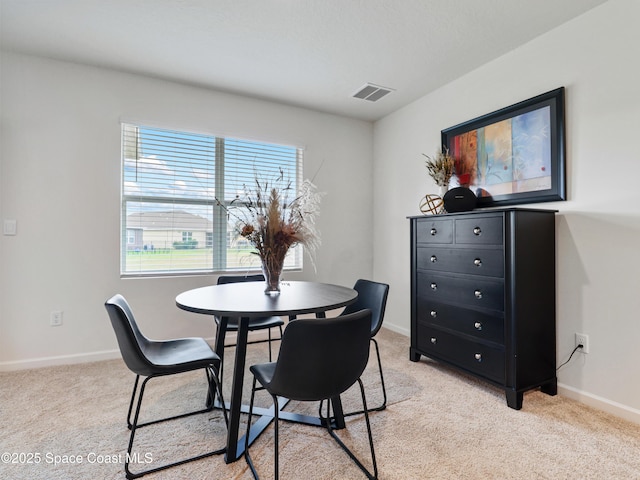 view of carpeted dining area