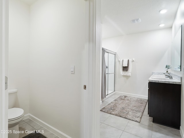 bathroom with walk in shower, tile patterned floors, toilet, and vanity