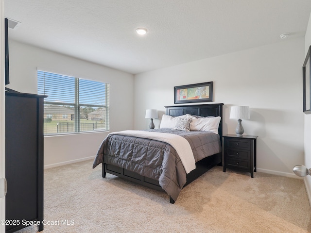 bedroom with light carpet