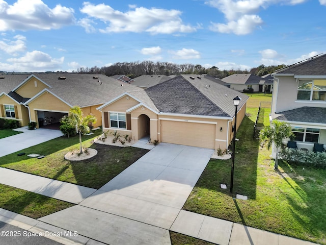 view of front facade featuring a garage and a front lawn