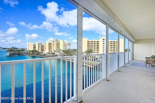 balcony featuring a water view