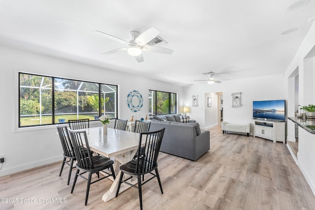 dining space with plenty of natural light, ceiling fan, and light wood-type flooring