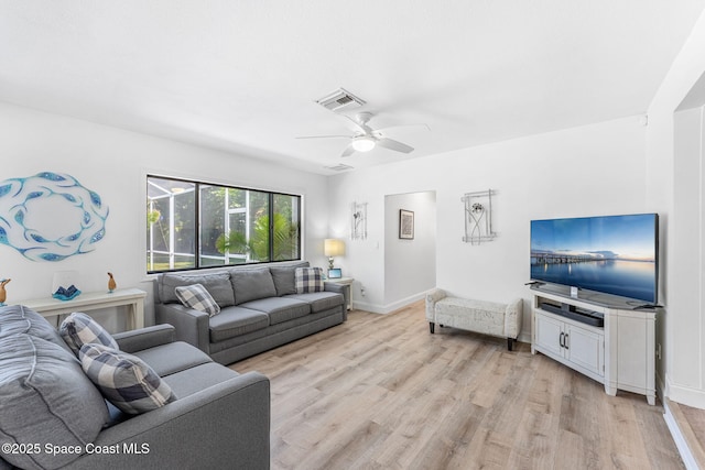 living room with ceiling fan and light wood-type flooring