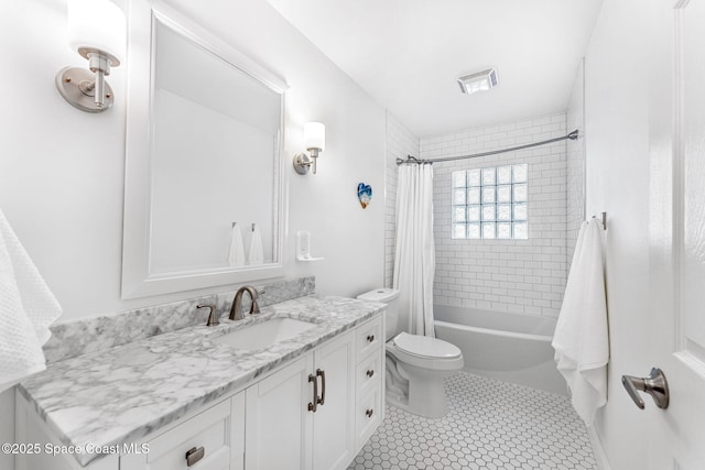 full bathroom with vanity, shower / tub combo with curtain, tile patterned floors, and toilet