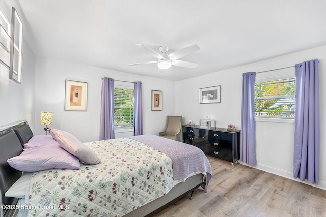 bedroom featuring light hardwood / wood-style flooring and ceiling fan