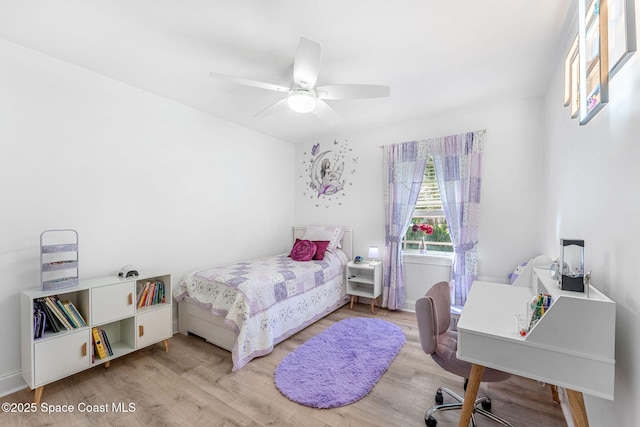 bedroom with light wood-type flooring and ceiling fan