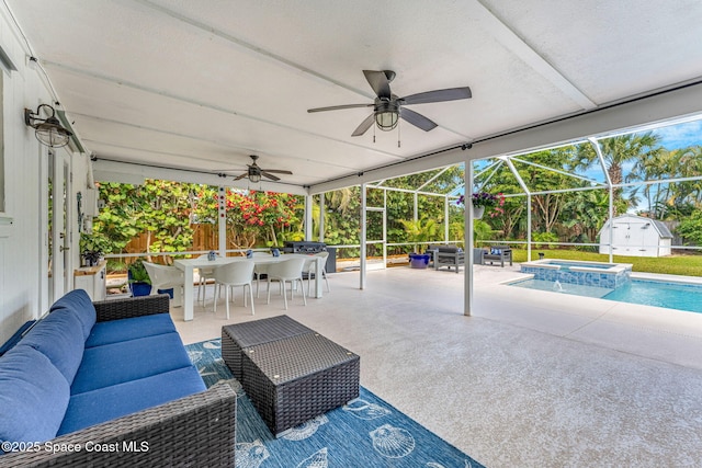 view of patio / terrace featuring a swimming pool with hot tub, an outdoor hangout area, ceiling fan, and glass enclosure