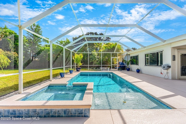 view of swimming pool featuring an in ground hot tub, pool water feature, a patio area, and glass enclosure