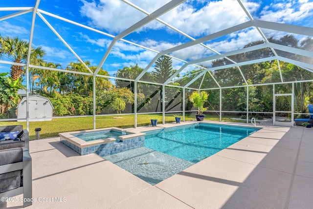 view of pool featuring an in ground hot tub, a storage shed, a patio, and glass enclosure