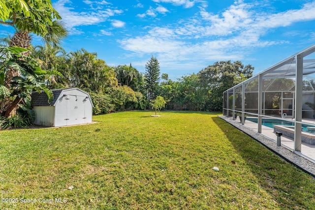 view of yard with a shed and a lanai