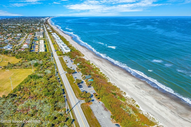 drone / aerial view with a view of the beach and a water view