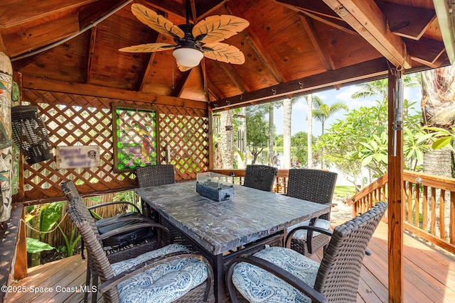 wooden terrace with ceiling fan and a gazebo