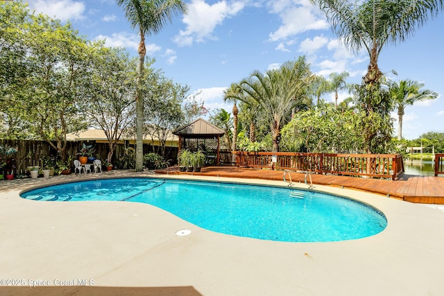 view of pool featuring a gazebo and a deck with water view