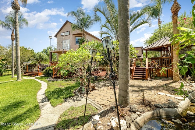 view of yard featuring a deck