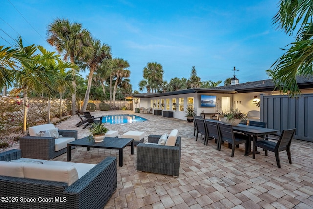 view of patio / terrace featuring a fenced in pool and outdoor lounge area