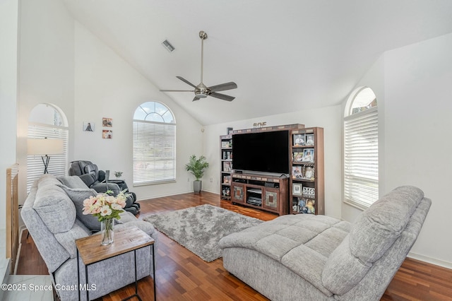 living room with hardwood / wood-style flooring, ceiling fan, and high vaulted ceiling