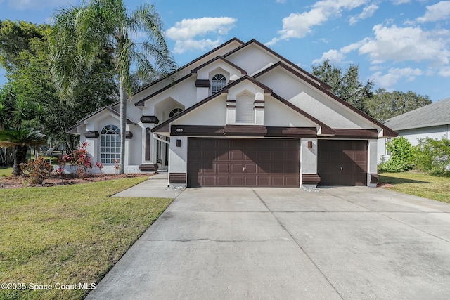 view of front of home featuring a garage and a front lawn