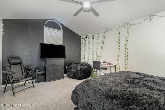 bedroom with ceiling fan, lofted ceiling, and carpet floors