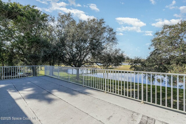 view of patio with a water view