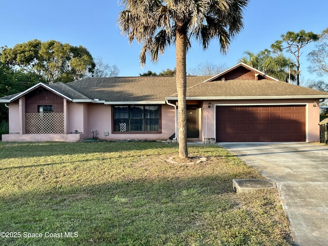 ranch-style house with a garage and a front lawn