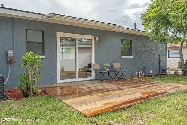 back of property featuring a wooden deck