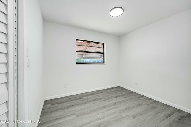 empty room with light hardwood / wood-style floors