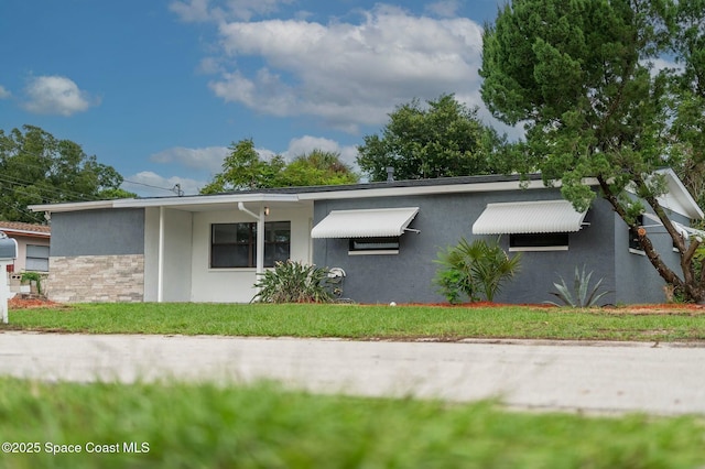 exterior space with a front lawn