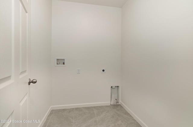 washroom with light tile patterned floors, hookup for an electric dryer, and hookup for a washing machine