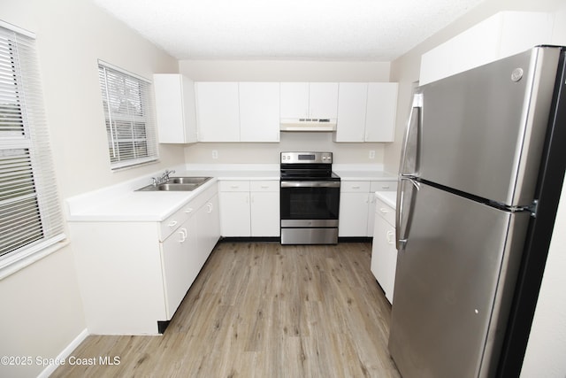 kitchen featuring sink, white cabinets, and appliances with stainless steel finishes