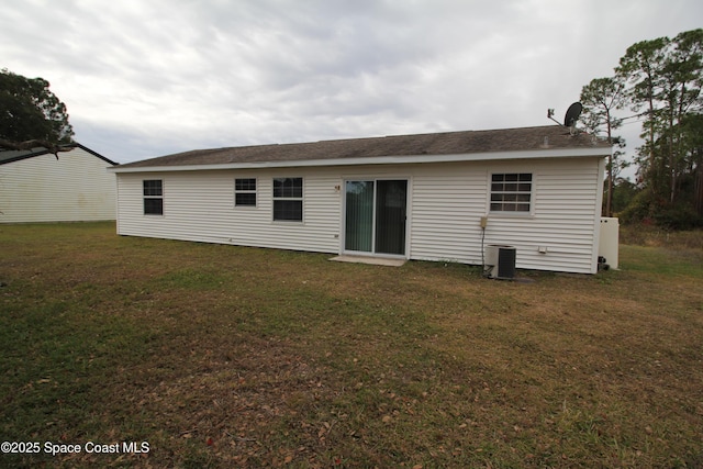 rear view of house with a yard