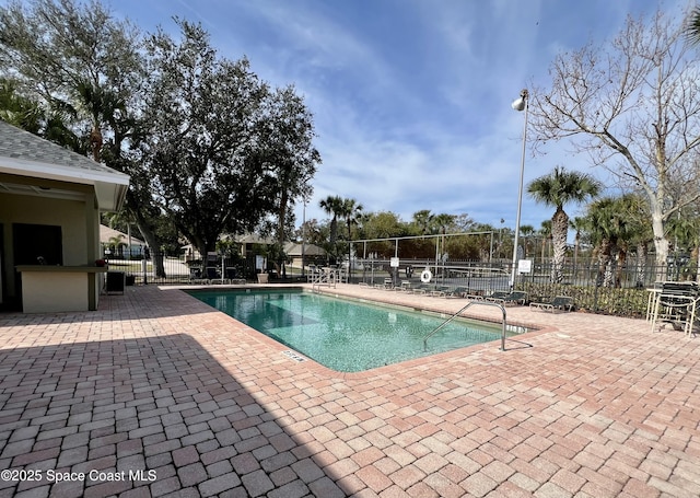 view of swimming pool with a patio area