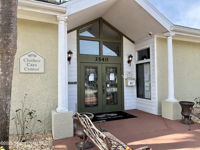 doorway to property featuring french doors