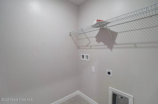 laundry room featuring tile patterned floors, hookup for a washing machine, and electric dryer hookup