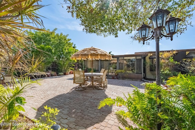 view of patio / terrace with a sunroom