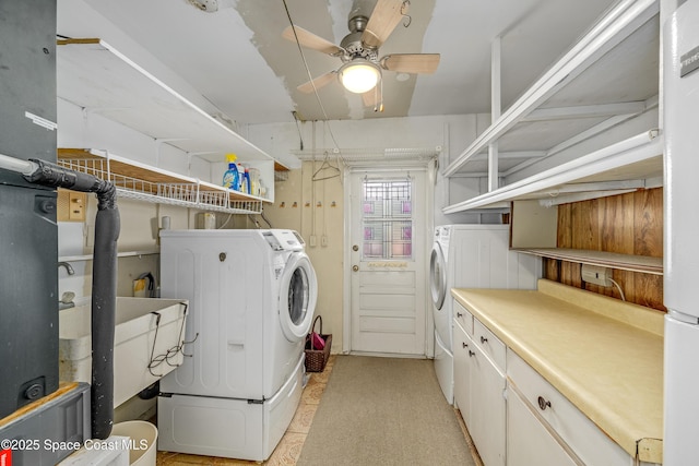 laundry room with washing machine and dryer and ceiling fan