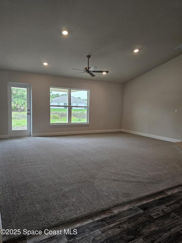 3317 Fitzpatrick Ave SW, Palm Bay, FL 32908 - unfurnished room featuring baseboards, ceiling fan, recessed lighting, and carpet floors