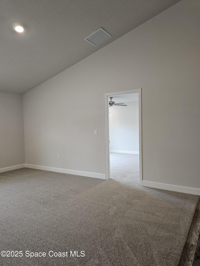 3317 Fitzpatrick Ave SW, Palm Bay, FL 32908 - empty room with carpet floors, baseboards, lofted ceiling, recessed lighting, and a textured ceiling