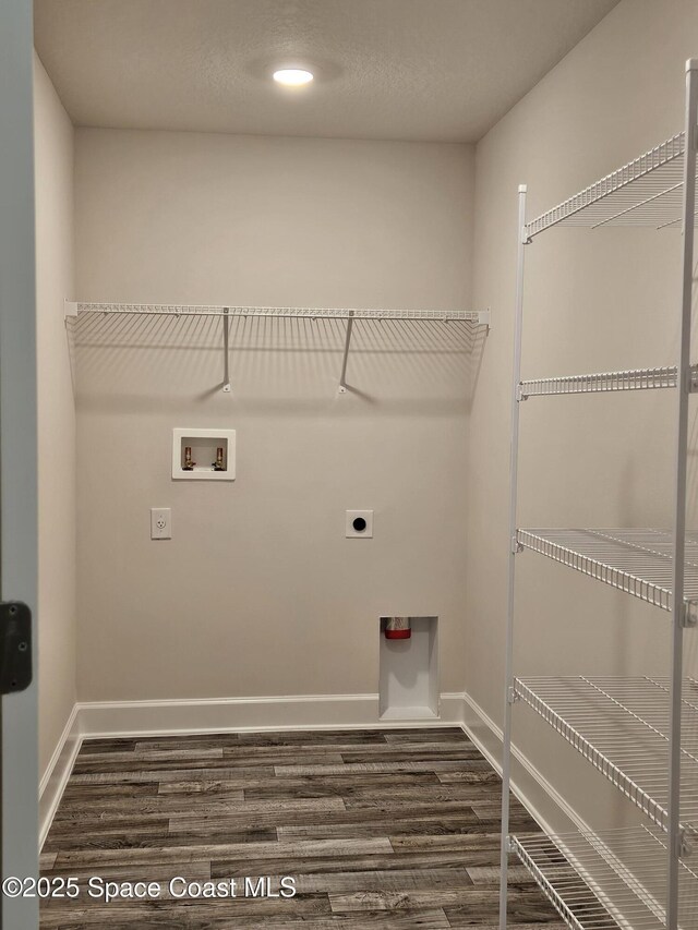 3317 Fitzpatrick Ave SW, Palm Bay, FL 32908 - washroom featuring hookup for an electric dryer, washer hookup, dark wood finished floors, baseboards, and recessed lighting