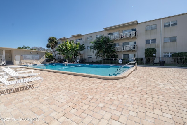 view of swimming pool featuring a patio area