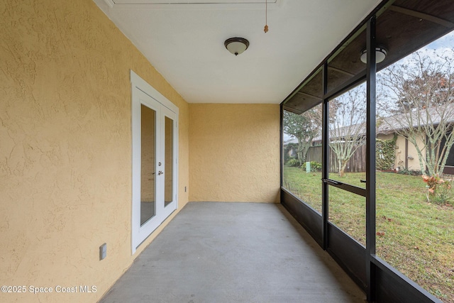 unfurnished sunroom featuring french doors