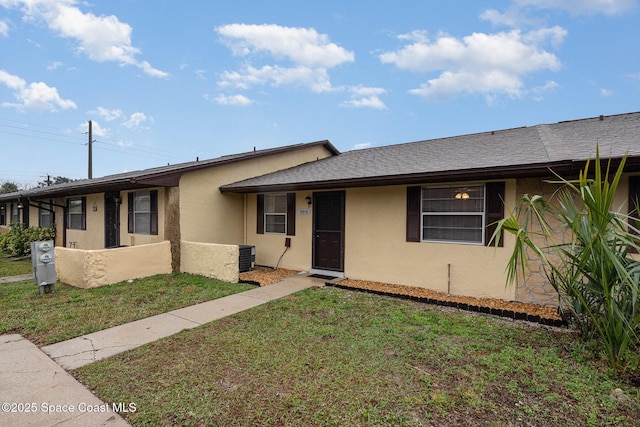 single story home featuring a front yard