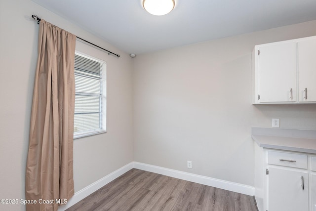 unfurnished dining area featuring light hardwood / wood-style floors