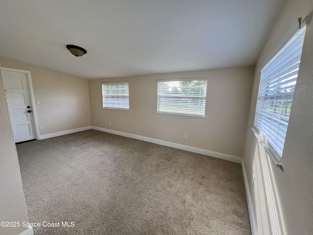 spare room with light colored carpet