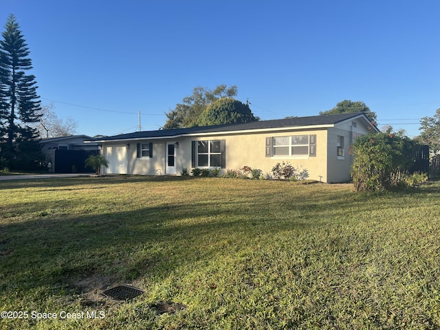 ranch-style house with a front lawn