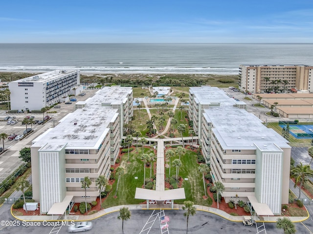 aerial view featuring a water view and a beach view